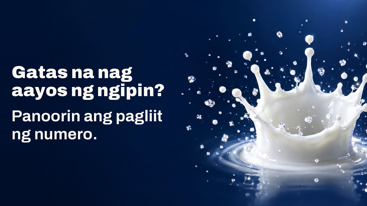 Gatas na nag aayos ng ngipin? Panoorin ang pagliit ng numero. Koronang talsik ng patak ng gatas na nakahinto sa ere na may maliliit na kumikinang na kristal, sa malalim na navy.