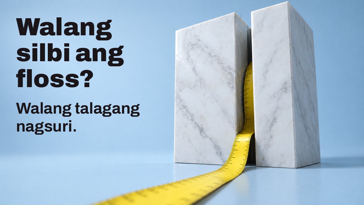 Walang silbi ang floss? Walang talagang nagsuri. Dilaw na panukat na lumalabas mula sa makitid na puwang ng dalawang puting bloke ng marmol, sa maputlang asul.