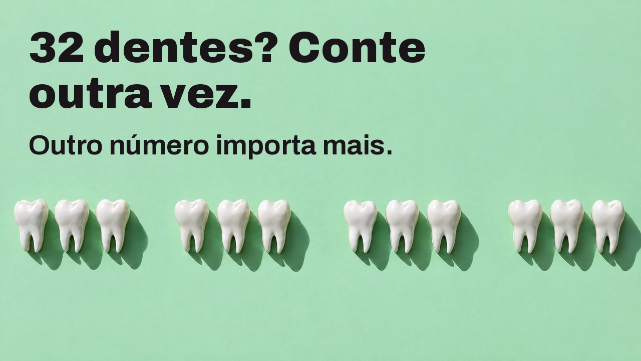 32 dentes? Conte outra vez. Outro número importa mais. Visto de cima: uma fila de esculturas de dentes brancos sobre verde menta, com espaços onde faltam dentes.