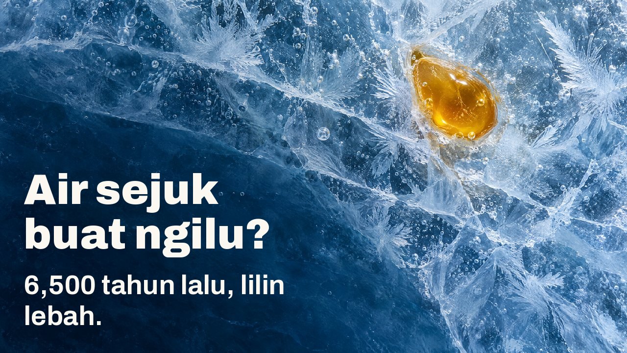 Air sejuk buat ngilu? 6,500 tahun lalu, lilin lebah. Dari atas: setitis lilin lebah keemasan membeku di dalam ais biru yang retak, dengan kristal fros dan gelembung udara.