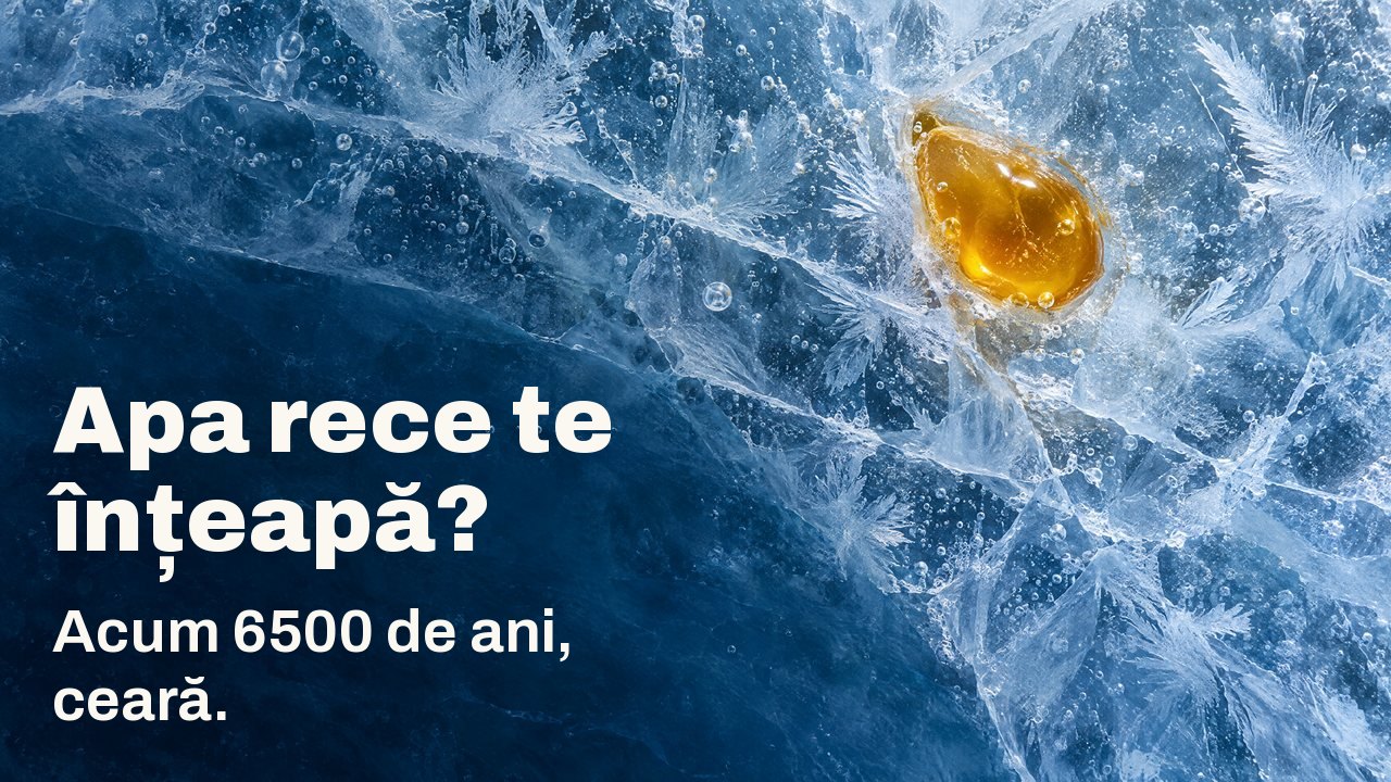 Apa rece te înțeapă? Acum 6500 de ani, ceară. Văzută de sus: o picătură de ceară de albine aurie prinsă în gheață albastră crăpată, cu flori de gheață și bule de aer.