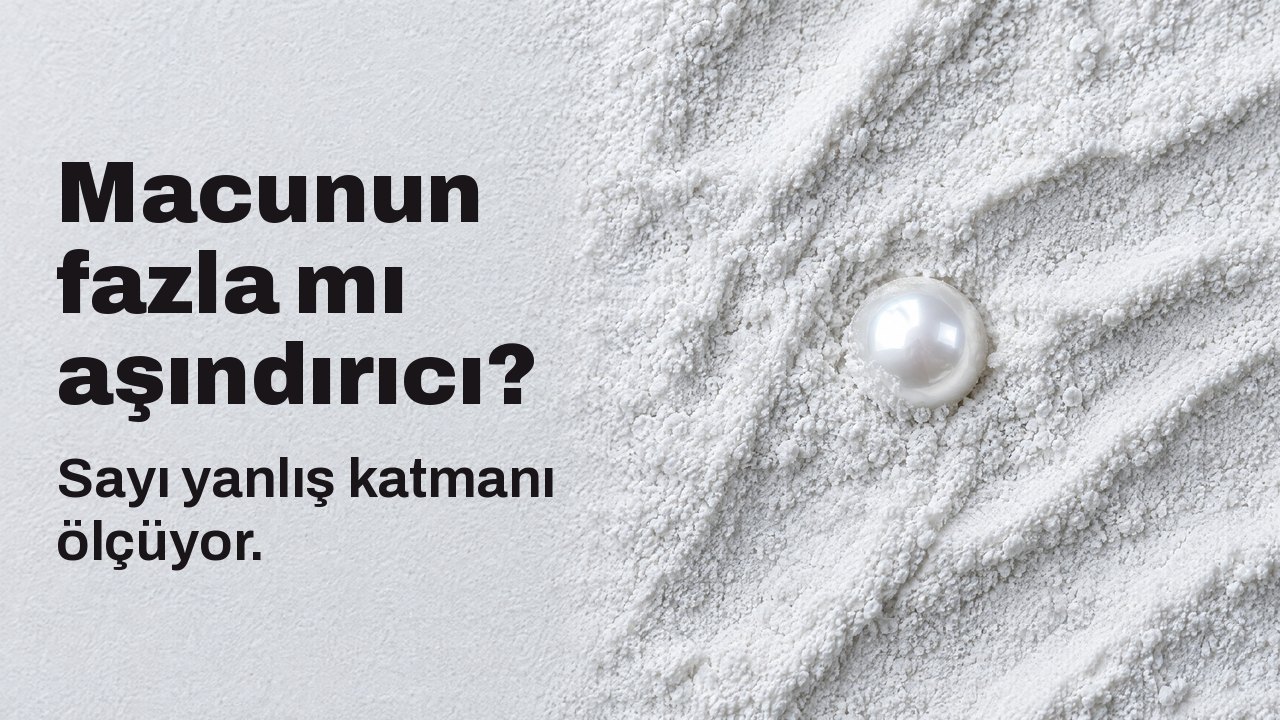 Macunun fazla mı aşındırıcı? Sayı yanlış katmanı ölçüyor. Yukarıdan: ince beyaz aşındırıcı toza yarı gömülü tek bir parlak inci.