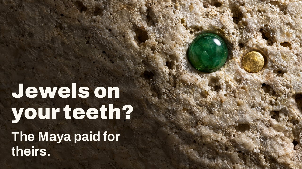 Jewels on your teeth? The Maya paid for theirs. Macro under raking light: a polished jade gem and a small gold disc set into rough pale limestone.